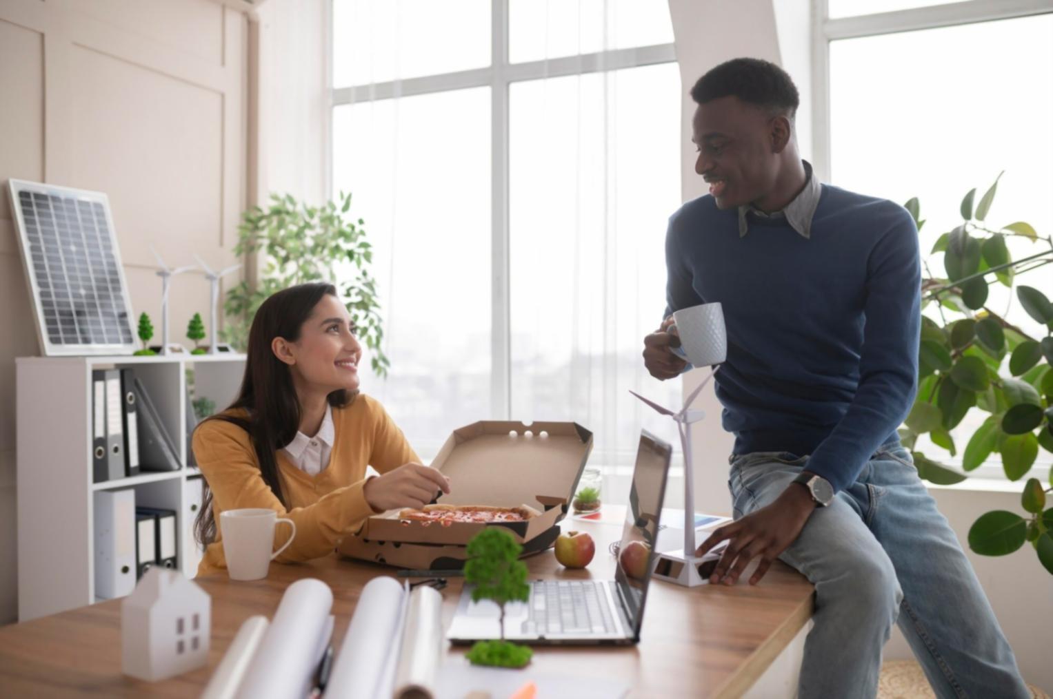 Business owner reviewing quarterly budget adjustments on laptop